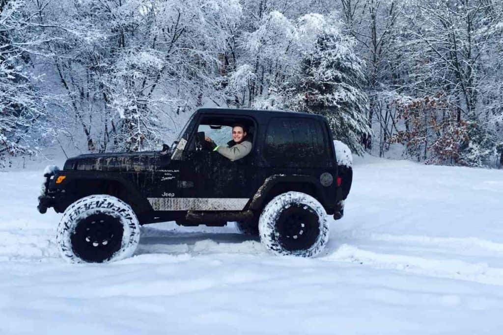 How heavy is a jeep wrangler hard top depends on the model, and the image shows an earlier Wrangler  in the snow 