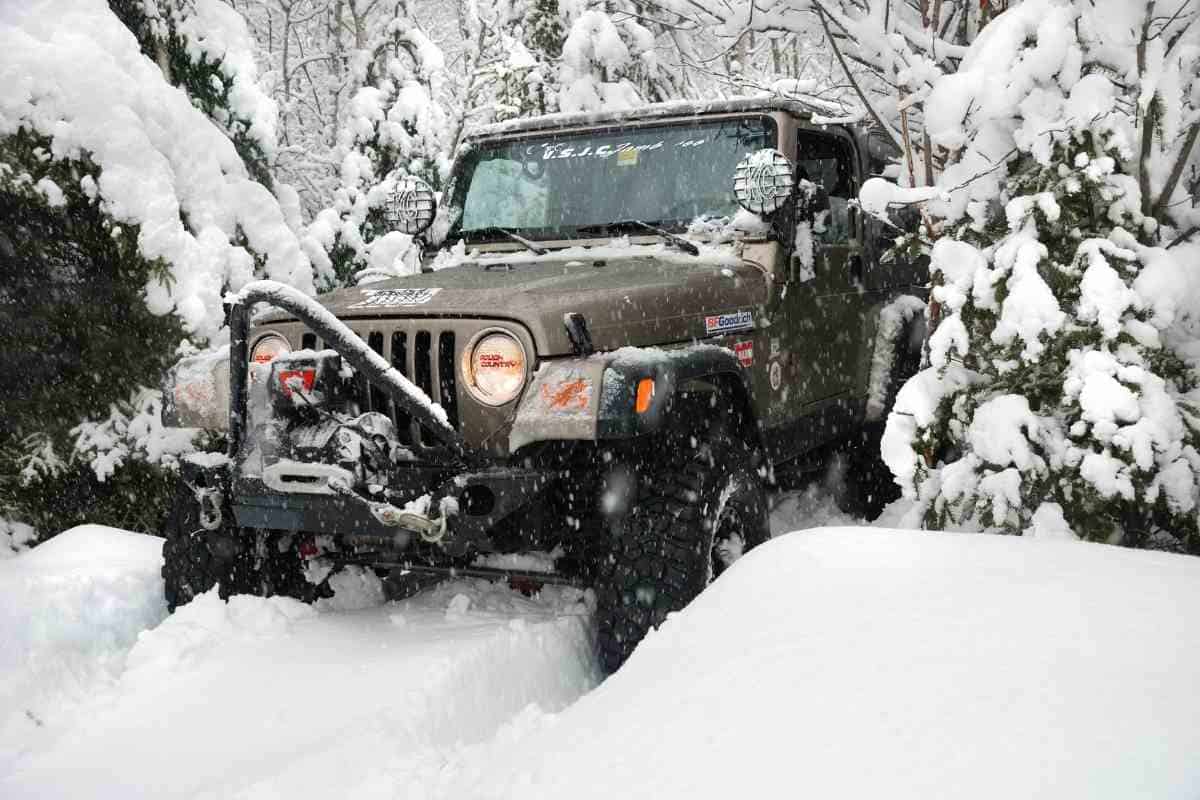 Image for the "best Jeep TJ" shows a modified Jeep TJ driving in deep snow