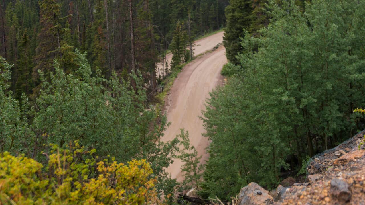 What does DAC mean in a 4Runner? The image shows a steep dusty road surrounded by trees