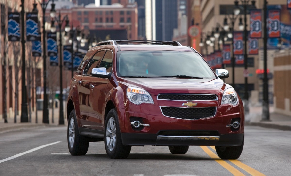 Image for which Chevy SUV is the most reliable shows a Chevy Equinox in burgundy, with an urban background
