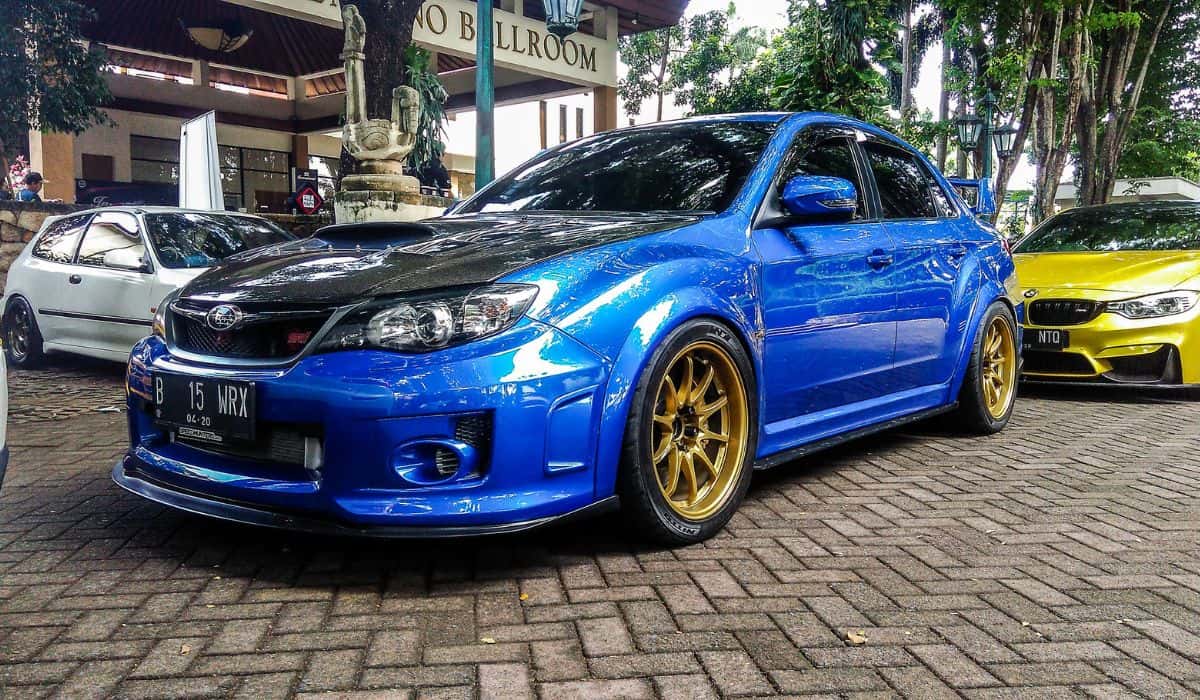 Blue Subaru WRX STI in a car meet