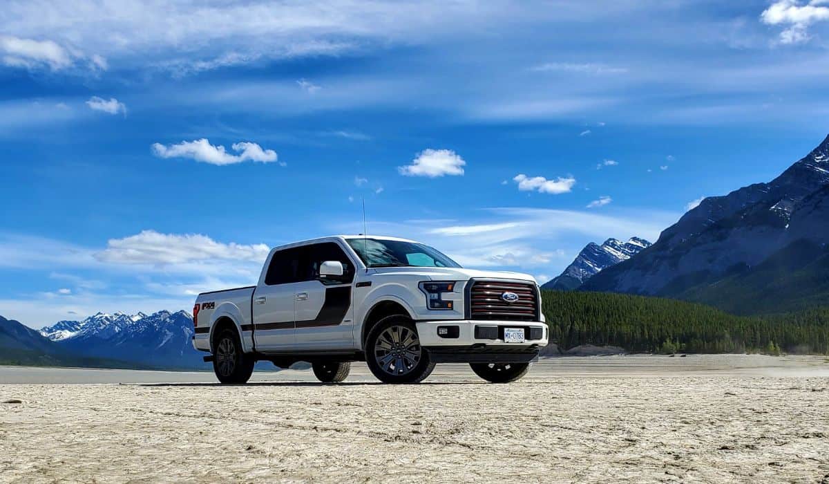 Ford F-150 truck in mountain river bed