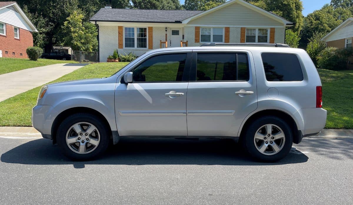 Honda Pilot in front of home