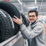 Male customer choosing new tires