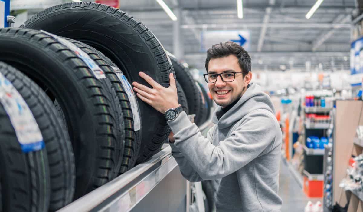 Male customer choosing new tires