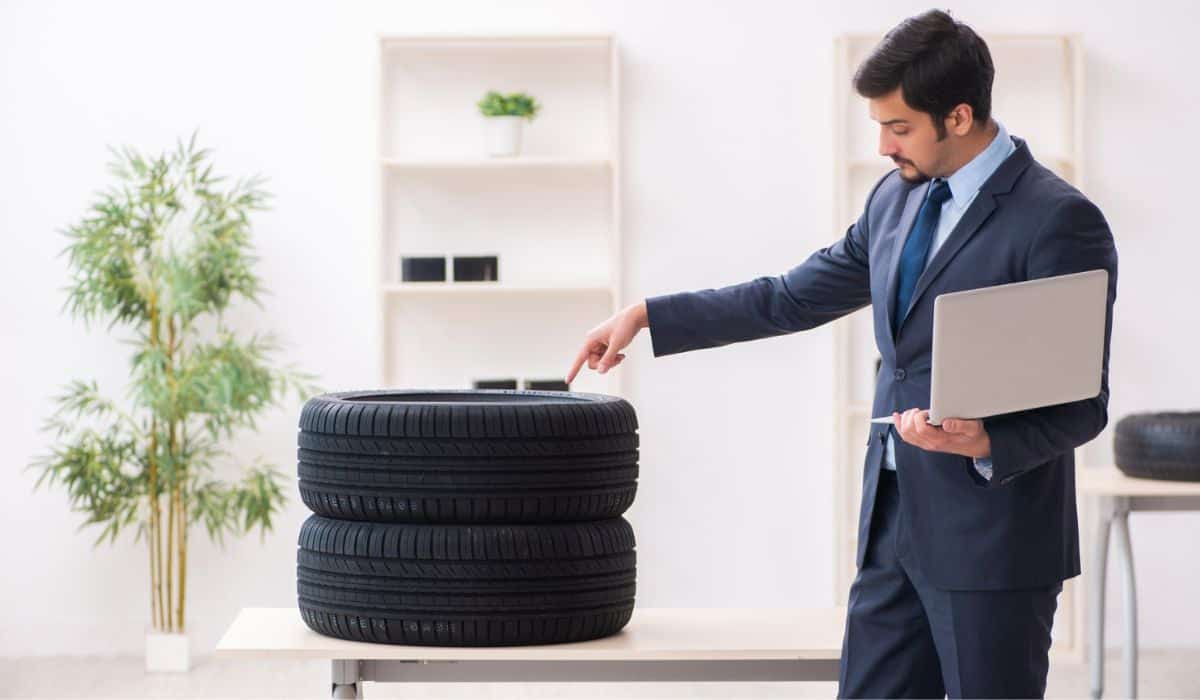 Young man selling tires in the office Are Sam's Club Tires Lower Quality? A Comprehensive Analysis