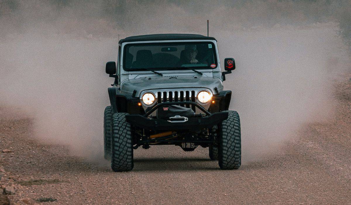 Black and Gray Jeep Wrangler on Dirt Road