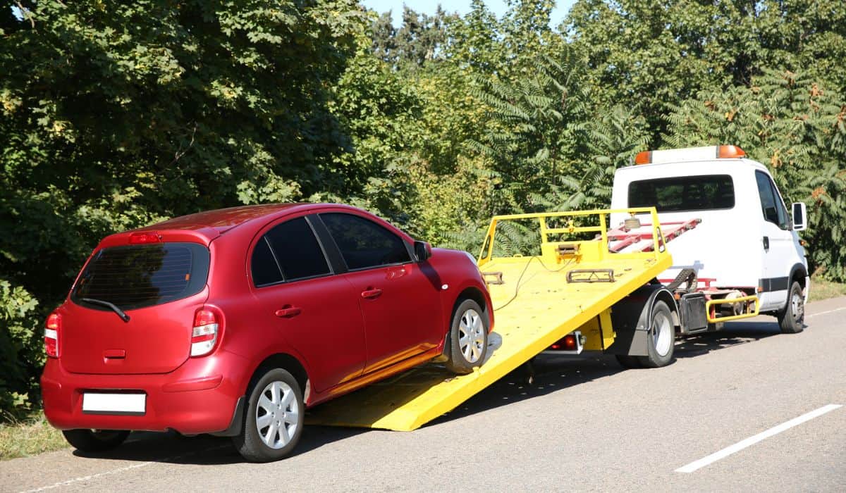 Broken car and tow truck