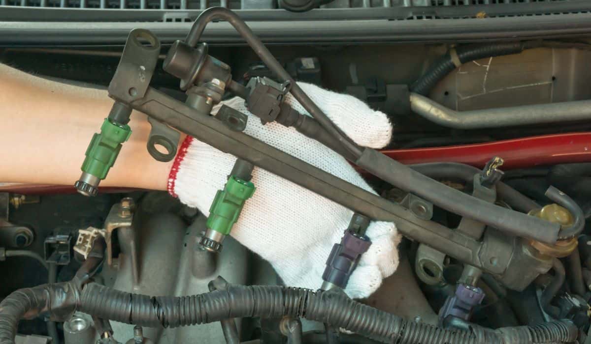 Car mechanic Checking fuel injector system