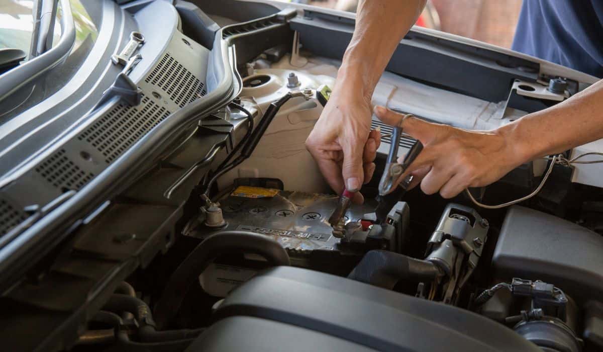 Engine engineer is replacing car battery because car battery is depleted