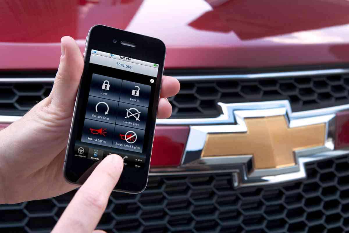 Gm To Drop Apple Carplay And Android Auto—Even On Gas Cars 1 A generic image for the article where a hand holds an iphone which uses Apple CarPlay.