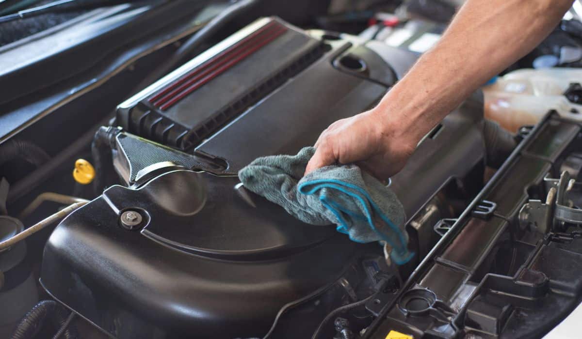 Mechanic cleaning car engine