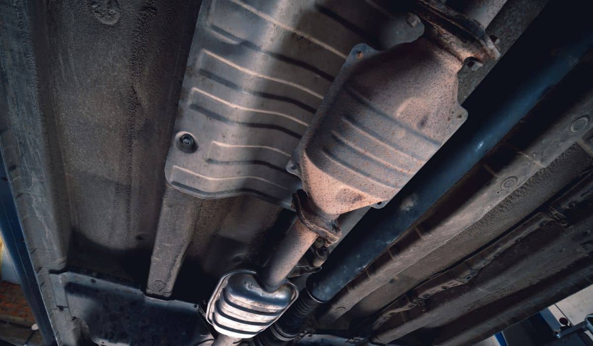 Vehicle underbody exhaust pipe, catalyst, resonator, exhaust system