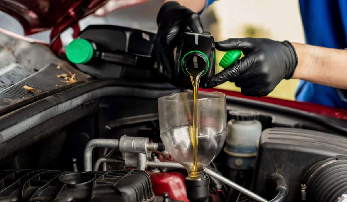 Changing replacement car oil with plastic bottle