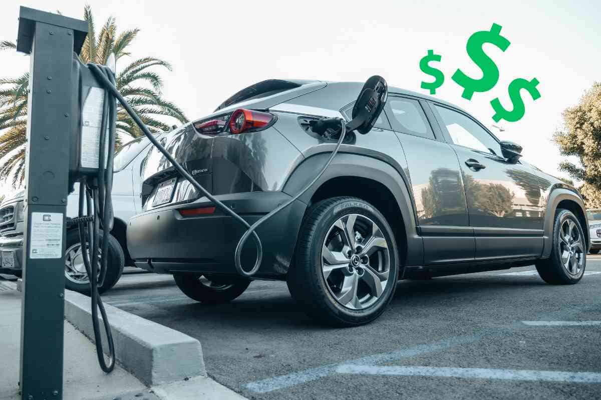  Why are electric cars expensive, the image shows an EV mazda being charged