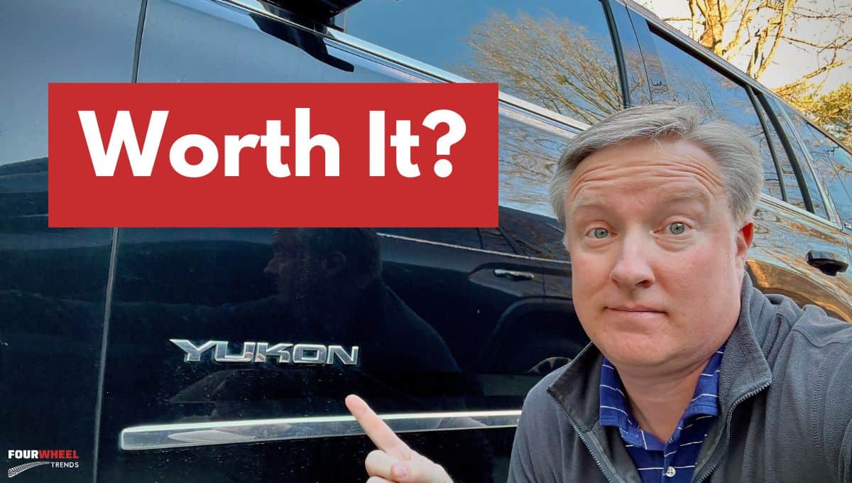 Is it worth buying a new SUV in 2024? original Photo of Kern beside his 2019 Yukon