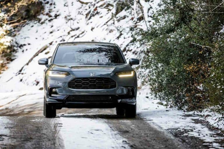 AWD vehicle driving on a snow covered road