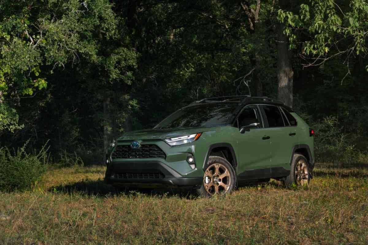 "are RAV4 4WD models worth it?" Image for the article shows a military green rav4 in a wooded area 