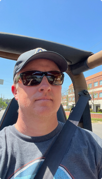 photo of Kern Campbell while driving his 1993 Jeep Wrangler YJ Sahara like he had in high school