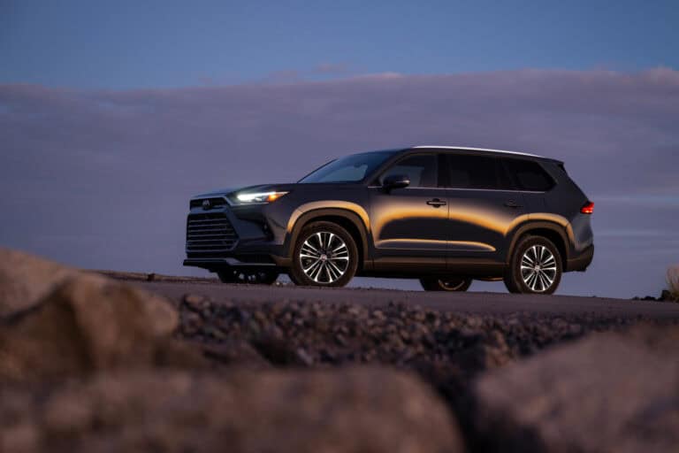 photo of the new 2025 Toyota Grand Highlander sitting on the top of a mountain