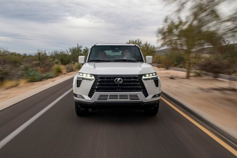 2025 Lexus GX 550 in white driving down the road