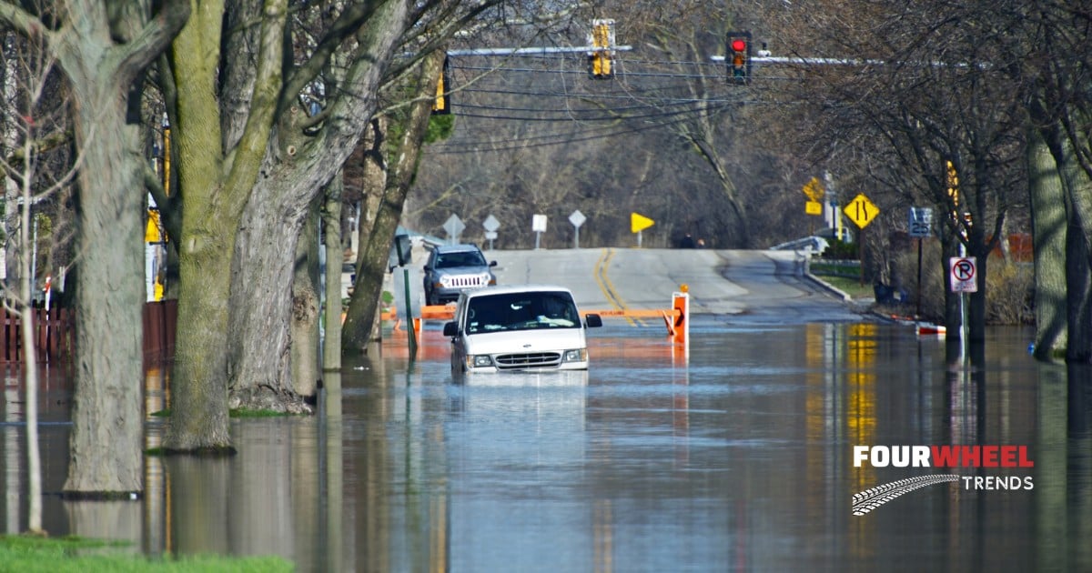 photo of a white work van in flood waters from a flash flood.