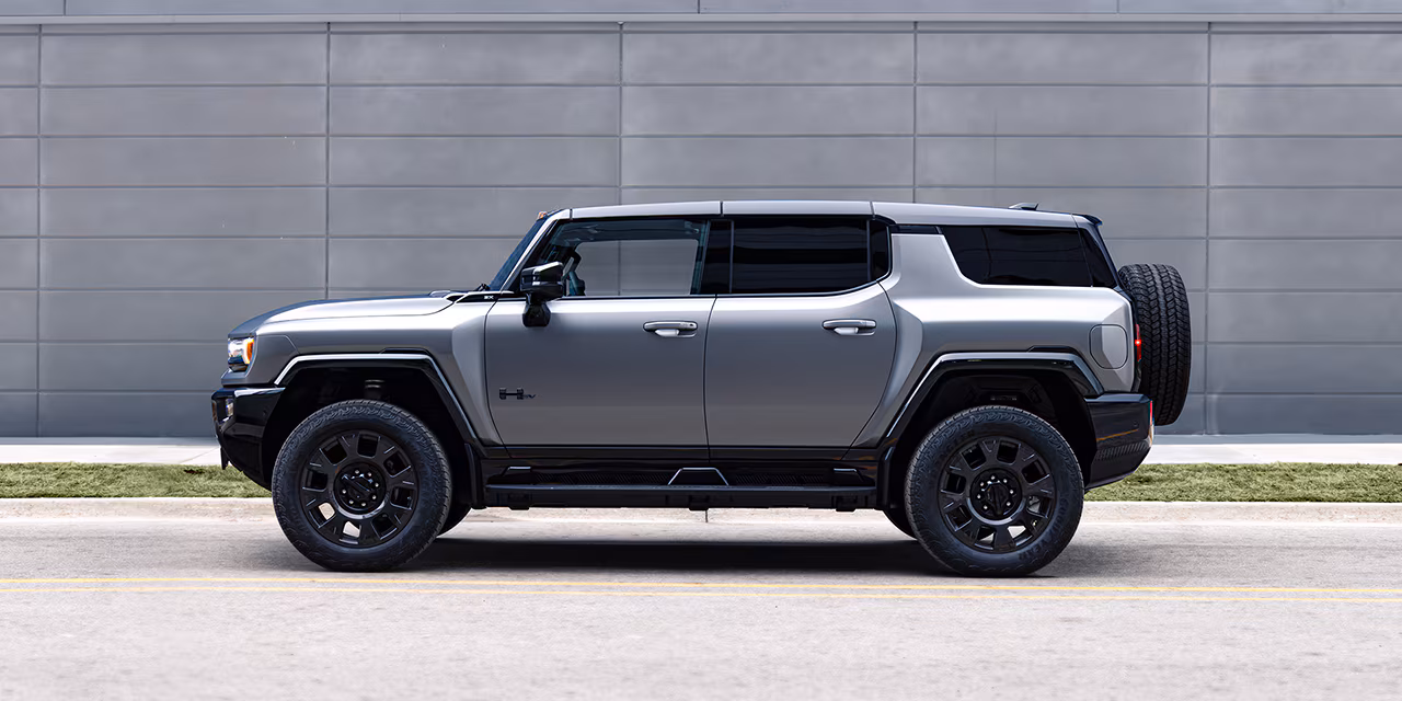 A Hummer EV SUV viewed from the side is the number one answer to what SUV has the highest towing capacity